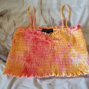Tye die pink and yellow crop top with spaghetti straps.